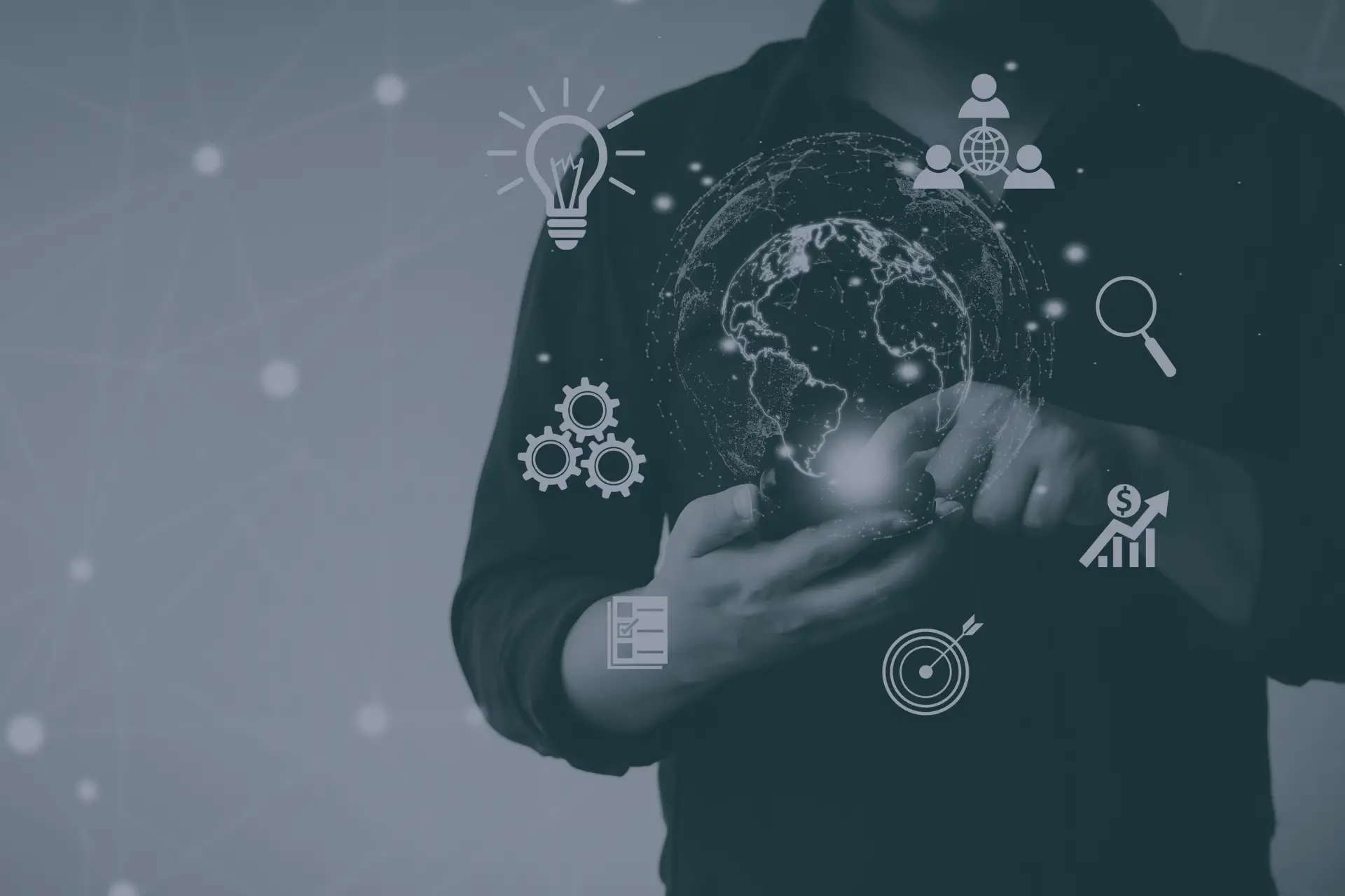 A man holding a phone with a globe icon symbolising working from anywhere. Used on about us page.