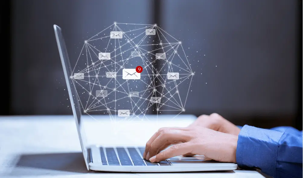 Understanding DMARC & DKIM: A Complete Guide for Businesses 2 Person on laptop with holograph showing secure email for dmarc and dkim.
