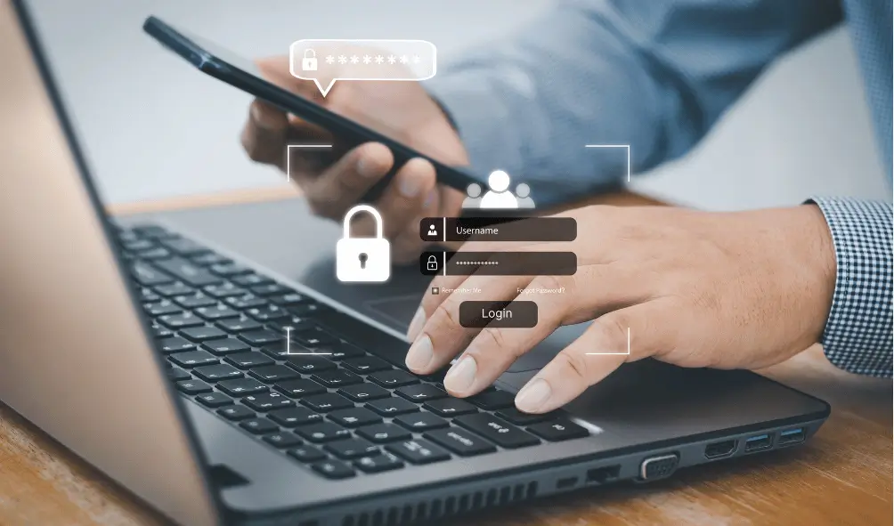 The Importance of MFA 2 Person on laptop logging in securely using multi-factor authentication, showing the importance of MFA