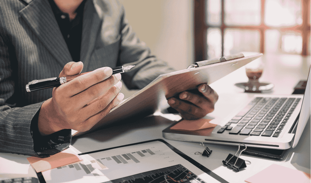 The Importance of Regular IT Audits for Data Security 2 Person performing an IT audit, part of a companies regular IT audits process.