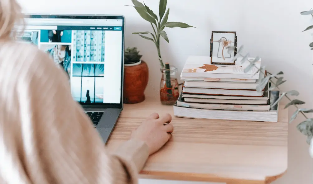 Top 10 Cyber Security Tips for Remote Workers 2 A remote worker working from home at desk on a laptop, working on business data collaborating with other remote workers.