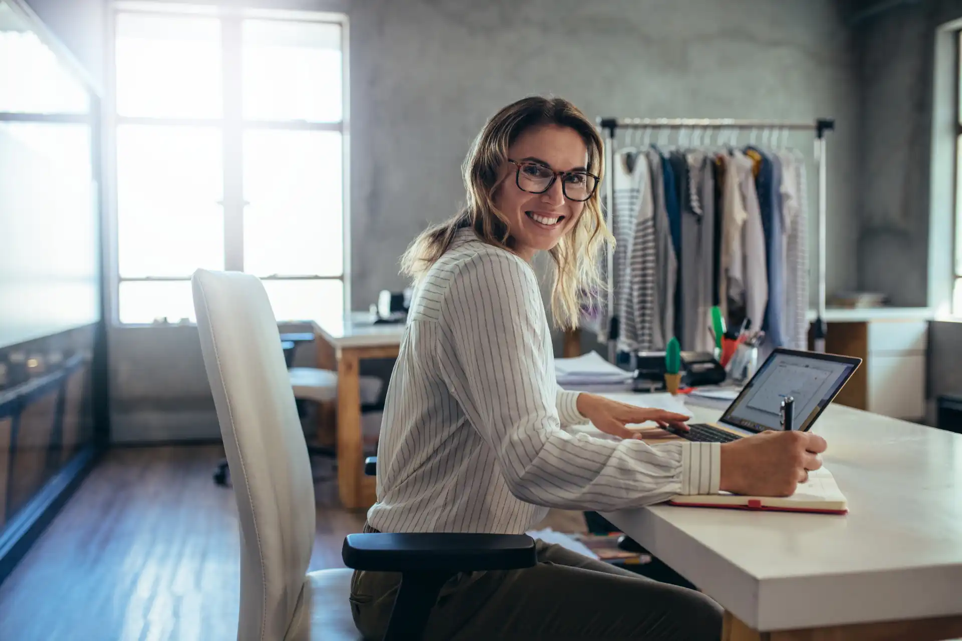 Happy business woman achieving goals with an integrated business productivity platform.