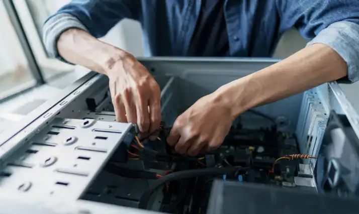 Expert computer repairs in Worthing - technician fixing a desktop PC with tools and diagnostic software.